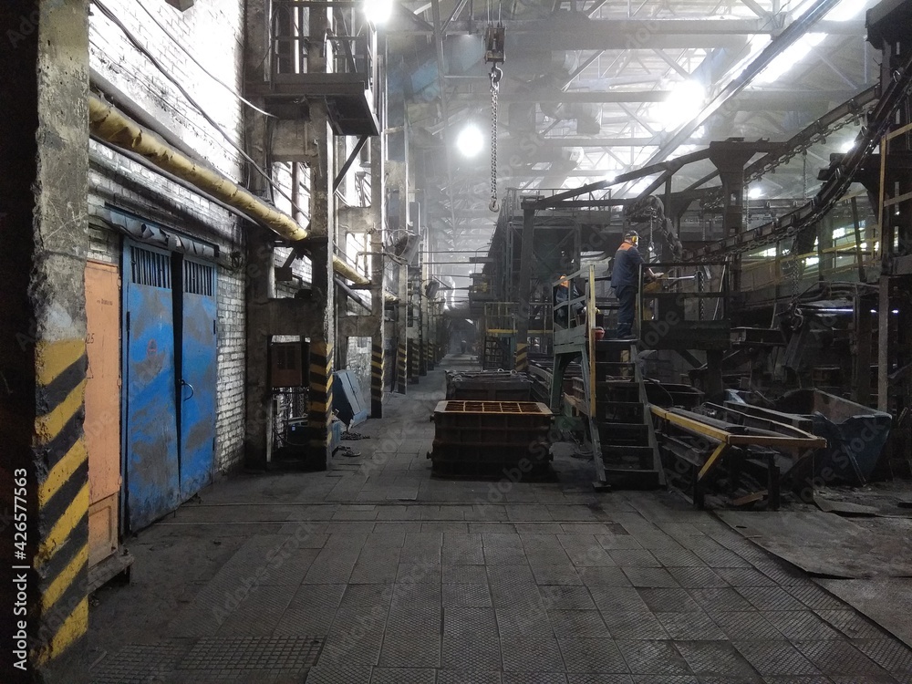 molding line in an old foundry with workers