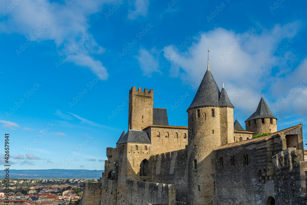 View to the historical castle carcassone - cite de carcassone - with the towers, background blue sky