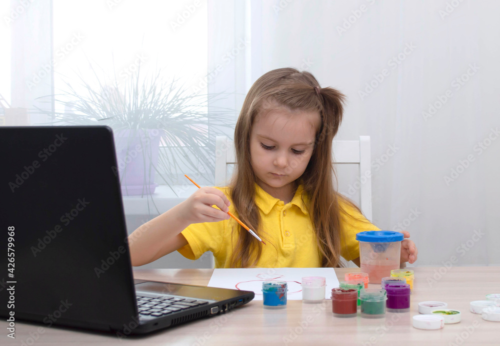 Concept of distance education. Girl learns draw online during self-isolation. Study online. Drawing lesson with laptop. Draw picture with colors. Life in digital age. back to school Concept of distance education. Girl learns draw online during self-isolation. Study online. Drawing lesson with laptop. Draw picture with colors. Life in digital age. back to school