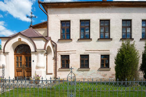 View of the stone two-story abbot building (1530s) with a fraternal refectory, kitchen and cells. Holy Dormition Monastery, Staritsa, Tver Region. photo