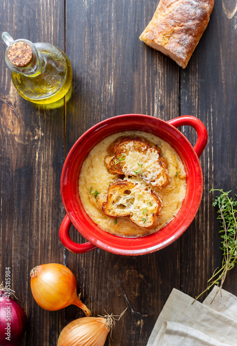 French onion soup with toasts and cheese. French cuisine. Vegetarian food. photo