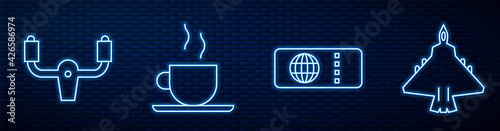 Set line Airline ticket, Aircraft steering helm, Coffee cup and Jet fighter. Glowing neon icon on brick wall. Vector