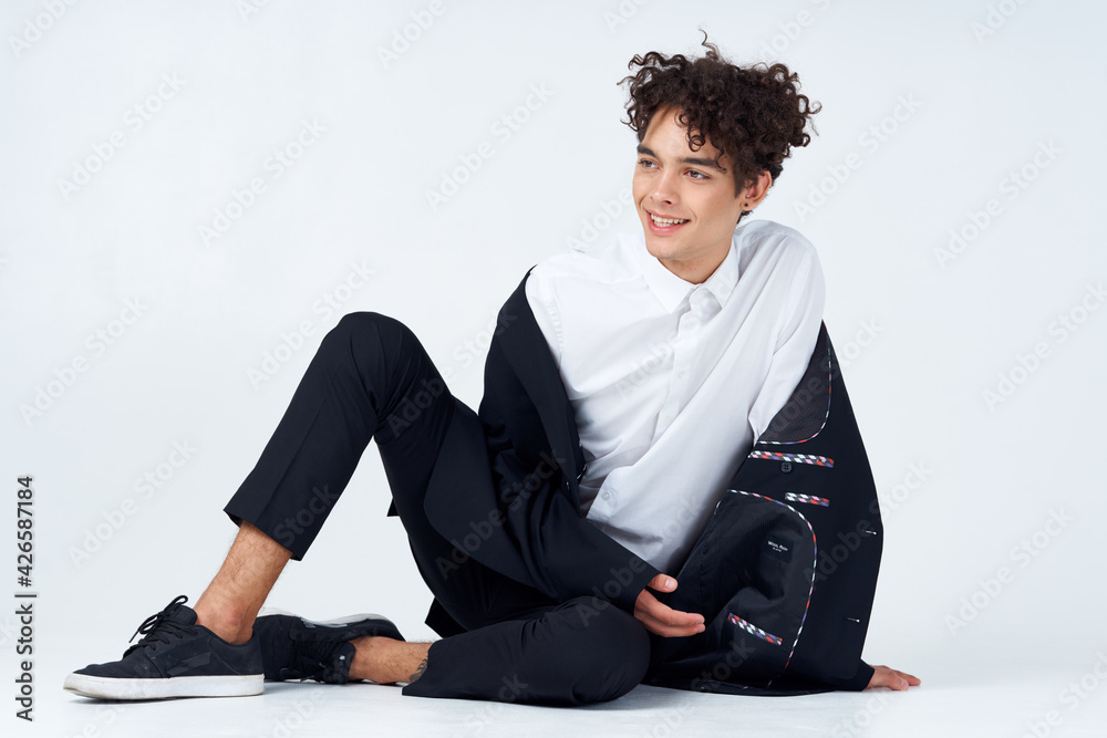man in suit curly hair light background studio lifestyle close-up man in suit curly hair light background studio lifestyle close-up