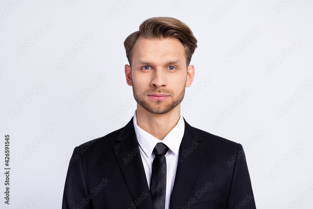 Photo portrait of serious businessman wearing suit isolated on white color background Photo portrait of serious businessman wearing suit isolated on white color background
