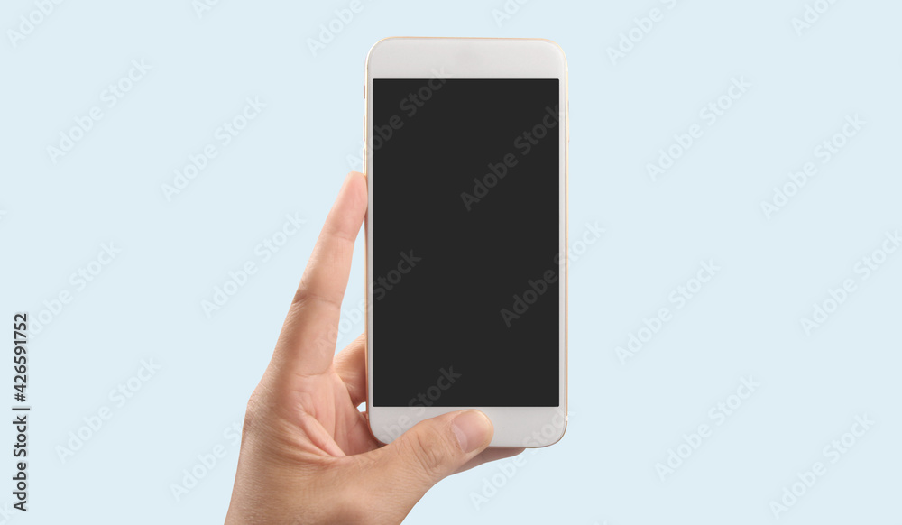 Hand holding smartphone device touching screen Hand holding smartphone device touching screen