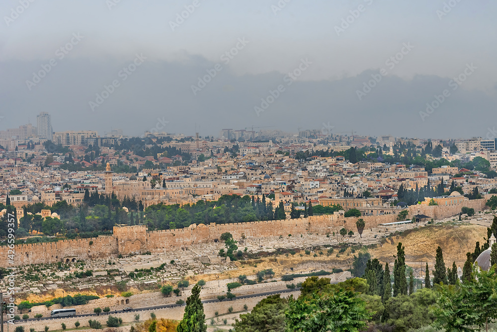 Panorama of the old city Jerusalem and monumental defensive walls. World holy places in Israel