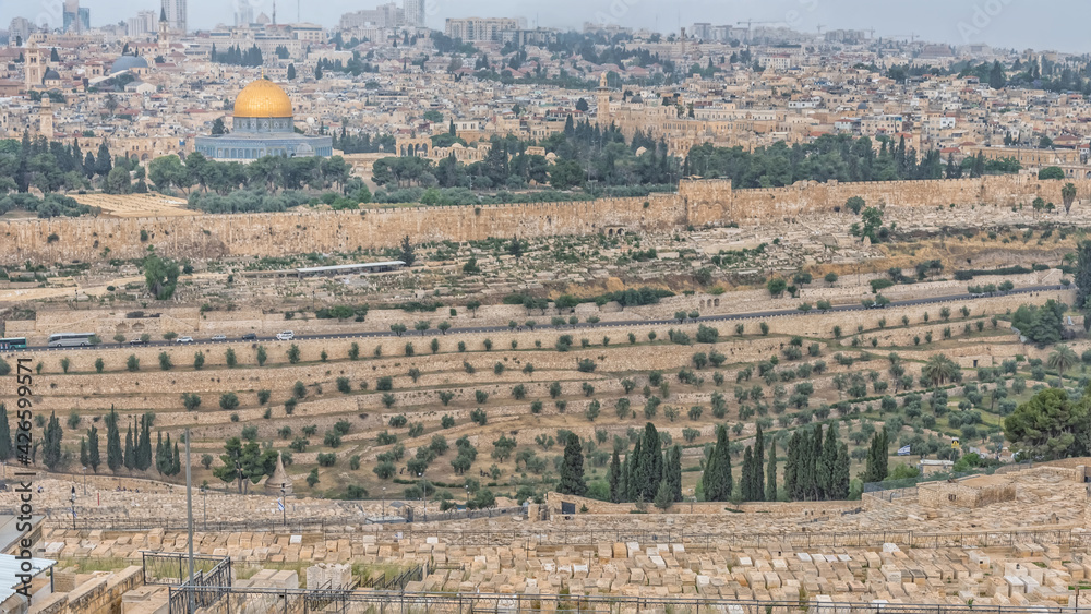 The Jewish Cemetery on the Mount of Olives, the Dome of the Rock. Most important world holy places. Panorama of the old city Jerusalem and monumental defensive walls