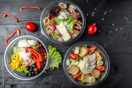 Set healthy light diet salad in plastic package for take away or food delivery. food in containers. place for text, top view