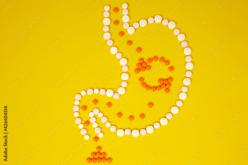 Obraz premium The human stomach from tablets, the metabolism in the body. Complete digestion process