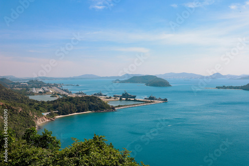 High point view for looking at the location of Sattahip Naval Base with clear sky and blue sea. Sea view and the island close to Sattahip Naval Base, Thailand. © chayakorn