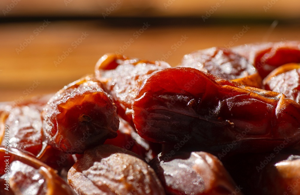 Backlight shot of sweet Khalas dates fruit from Saudi Arabia ready for ramadan Backlight shot of sweet Khalas dates fruit from Saudi Arabia ready for ramadan