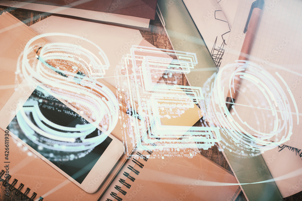 Double exposure of SEO hologram drawing over desktop. Top view. Search optimization concept. Double exposure of SEO hologram drawing over desktop. Top view. Search optimization concept.