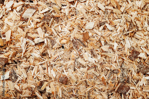 the texture of sawdust. production waste in woodworking. macro photo of small chips from sawing wood