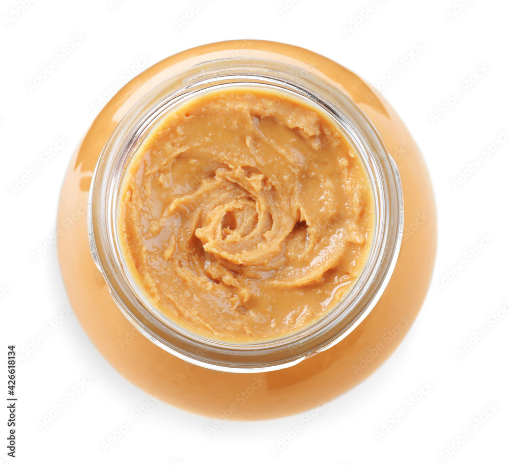 Delicious peanut butter in glass jar isolated on white, top view Delicious peanut butter in glass jar isolated on white, top view