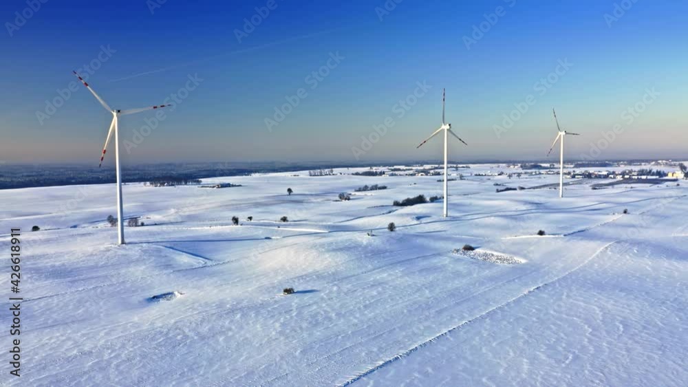 Wind turbines on snowy field. Alternative energy, Poland. Wind turbines on snowy field. Alternative energy, Poland.