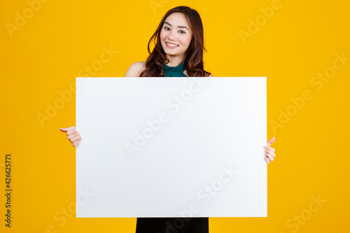 Wallpaper Mural Cute and pretty curly hair Asian female brunette holding white  blank board pose
