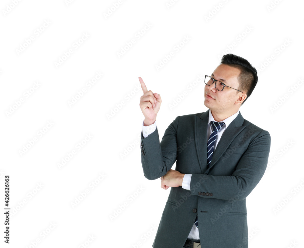 Young and handsome businessman executive look, wearing dark gray suit and eyeglasses standing with friendly face and self-confidence and pose hand in advertising pointing finger to blank copy space Young and handsome businessman executive look, wearing dark gray suit and eyeglasses standing with friendly face and self-confidence and pose hand in advertising pointing finger to blank copy space