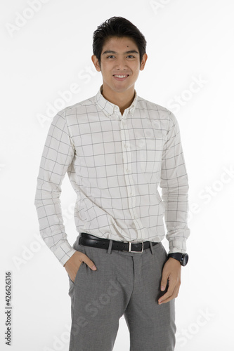 Portrait of self confidence young and handsome business Asian man with friendly and charming successful emotion pose against isolated on white background with hand in pocket © Bangkok Click Studio
