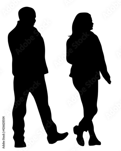 Young man and woman walking down the street. Isolated silhouette on a white background