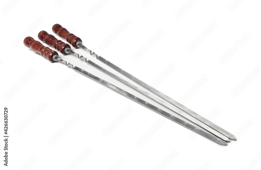 Metal skewers with wooden handle on white background