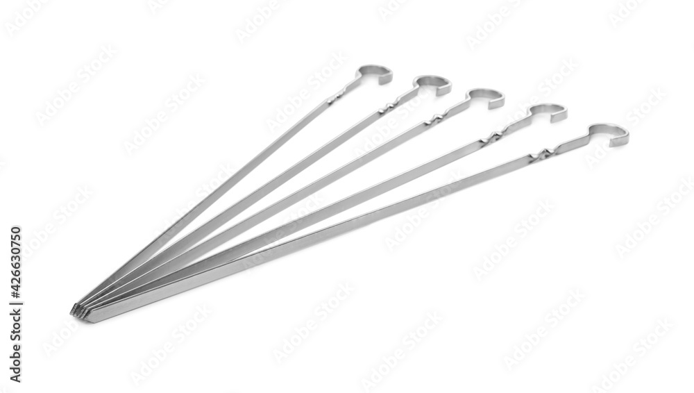 Metal skewers on white background. Barbecue utensil Metal skewers on white background. Barbecue utensil