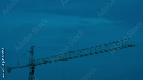 scenic close up of crane in time lapse night and day 