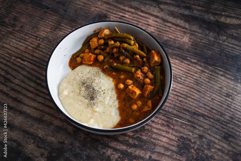 vegan chickpea green beans stew with tofu cubes and mashed potato, healthy plant-based food vegan chickpea green beans stew with tofu cubes and mashed potato, healthy plant-based food