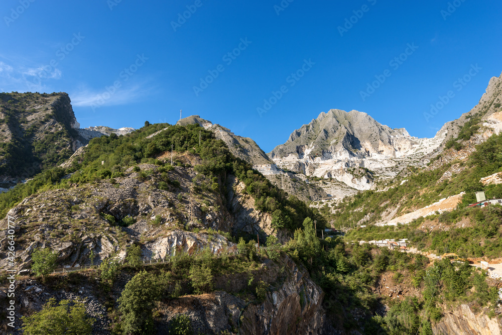 Obraz premium Landscape view of the famous white Carrara marble quarries on the Apuan Alps. Massa and Carrara province, Tuscany, Italy, Europe.
