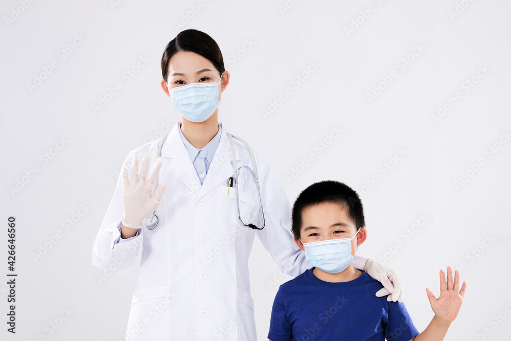 A woman doctor and a little boy waved