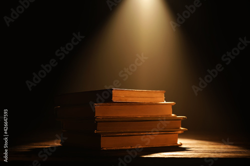 Old books on table against ...