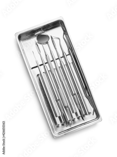 Tray with dentist's tools on white background