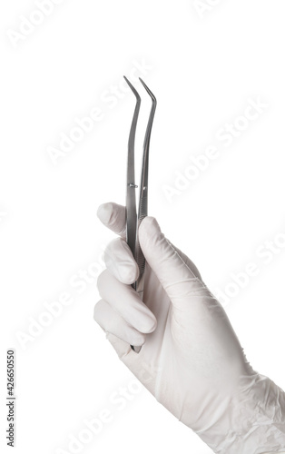 Dentist with instruments on white background