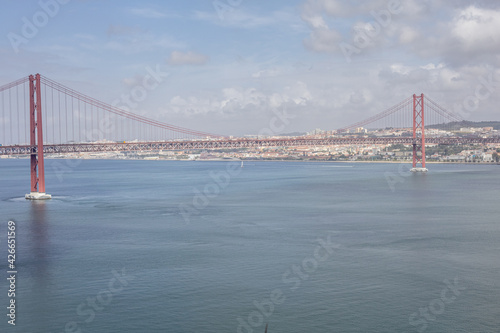 wide panorama overlooking the river and the big bridge on April 25 in Lisbon, Portugal
