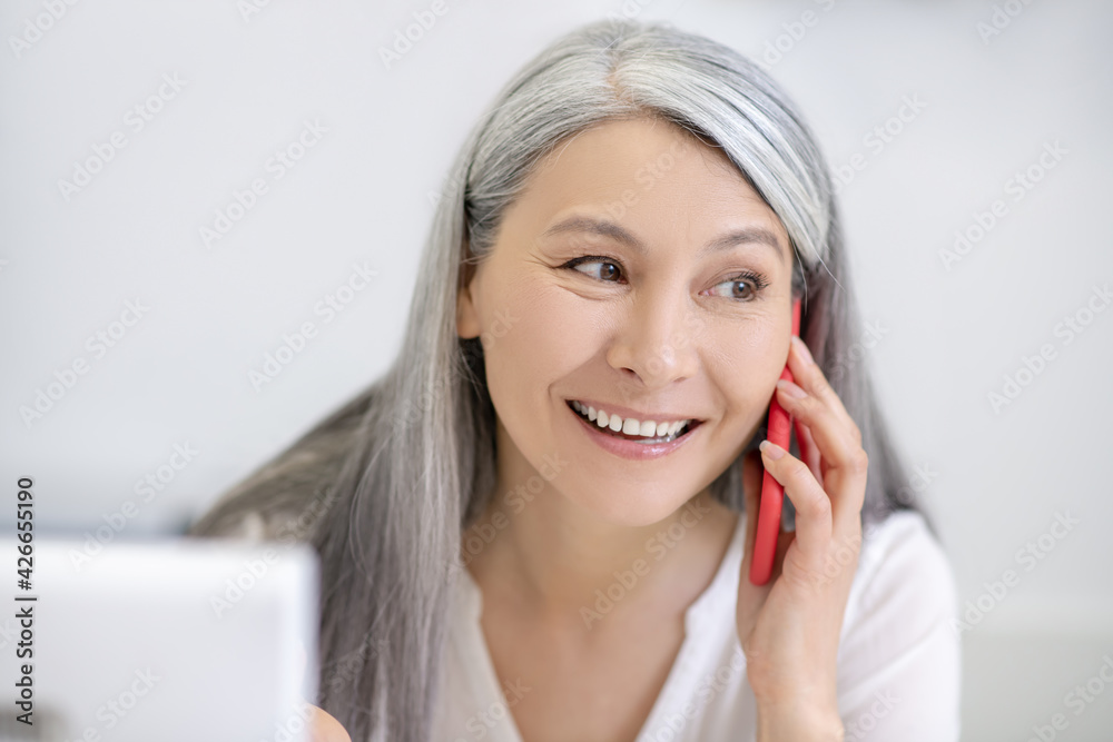 Close up face of woman talking on smartphone Close up face of woman talking on smartphone