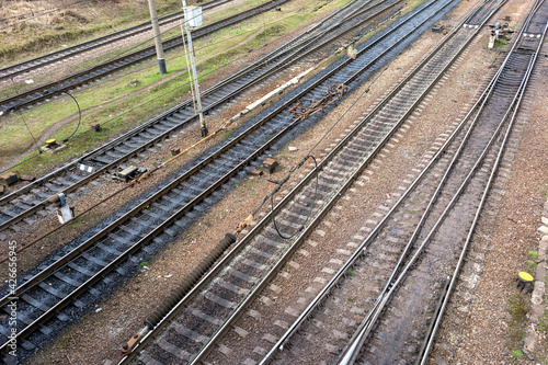Many railroad tracks run diagonally from left to right and up.