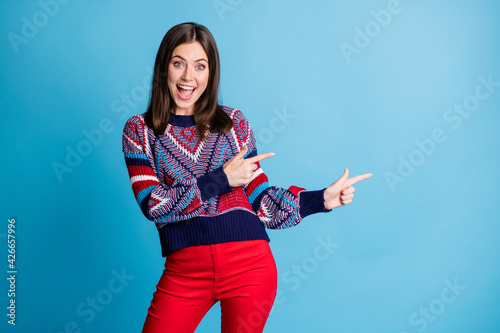 Photo portrait girl showing fingers blank space wearing casual clothes isolated bright blue color background