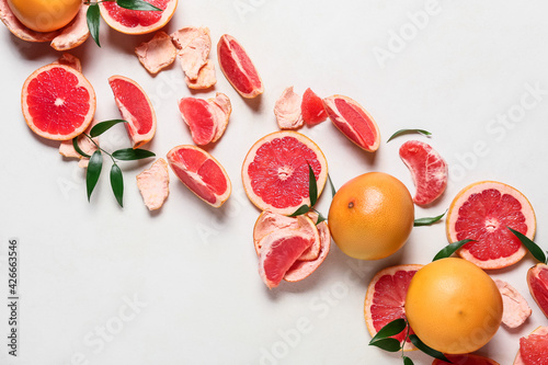 Composition with ripe grapefruits on white background