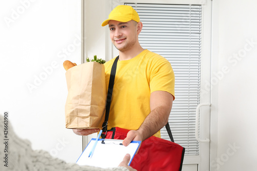 Woman receiving her order f...