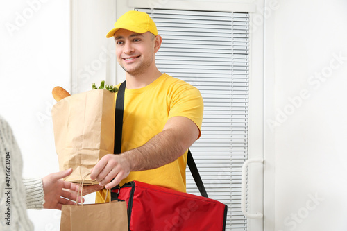 Woman receiving her order f...
