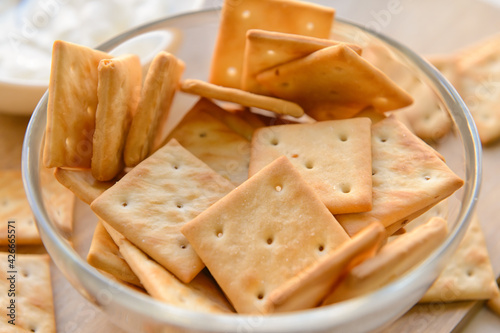 Bowl of tasty crackers, closeup