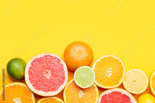 Fototapeta Naklejka Na Ścianę i Meble -  Fresh citrus fruits on color background