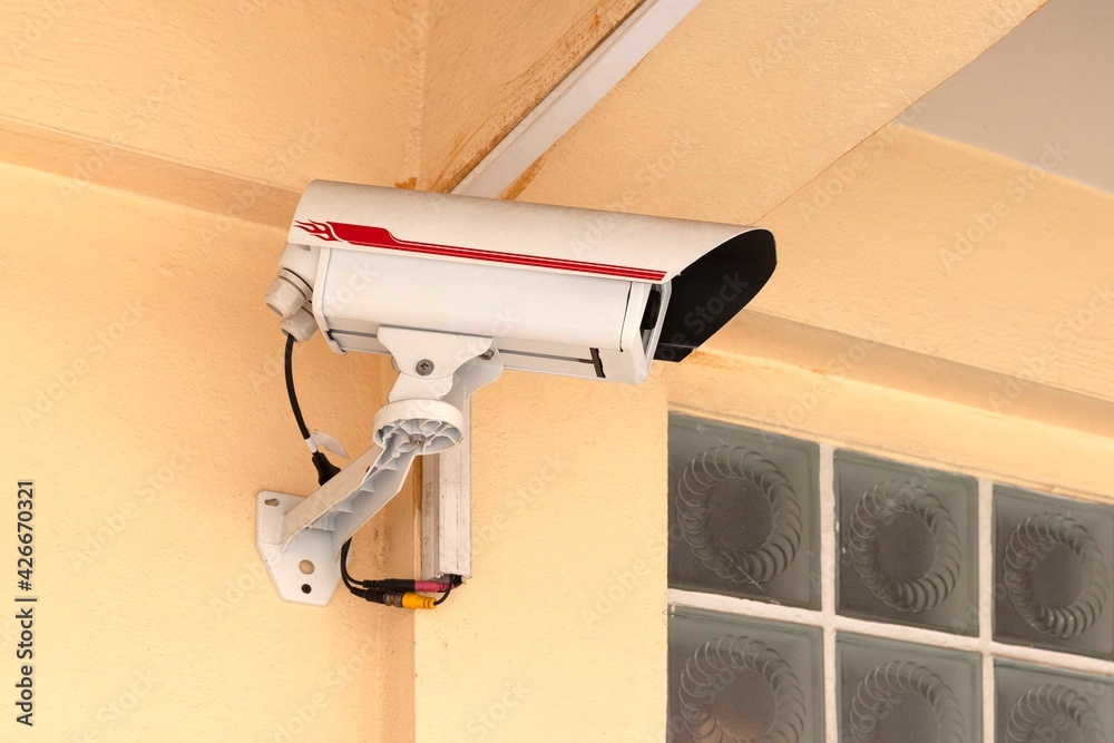 Close - up Cctv security camera under the house building Close - up Cctv security camera under the house building