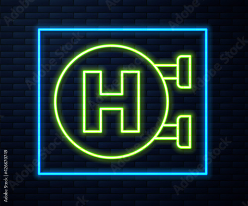 Glowing neon line Hospital signboard icon isolated on brick wall background. Vector