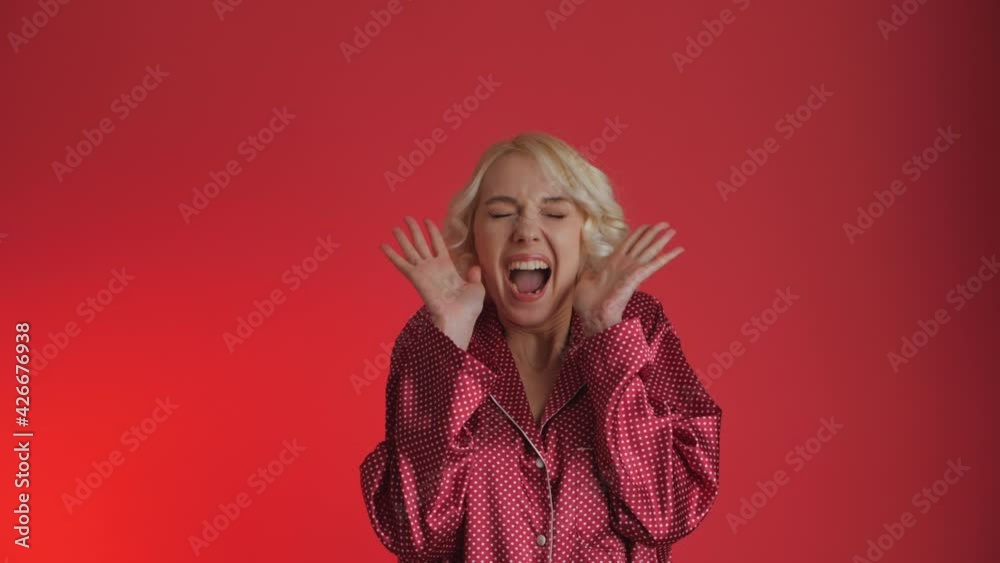 Fulfillment of desires. Gifts fall on the woman from above. The Girl receives many gifts. Prize, draw. Isolated on red background. Fulfillment of desires. Gifts fall on the woman from above. The Girl receives many gifts. Prize, draw. Isolated on red background.