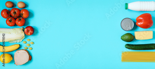 Food products on the blue background, copy space. Grocery banner.