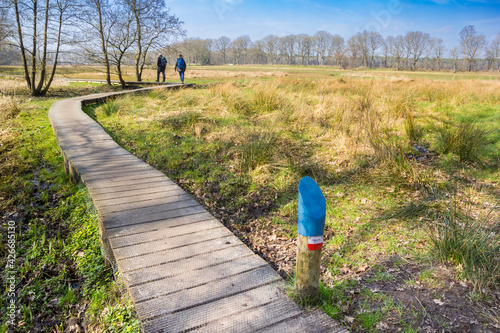 People walking the famous dutch Pieterpad walking path near Oudemolen, Netherlands photo