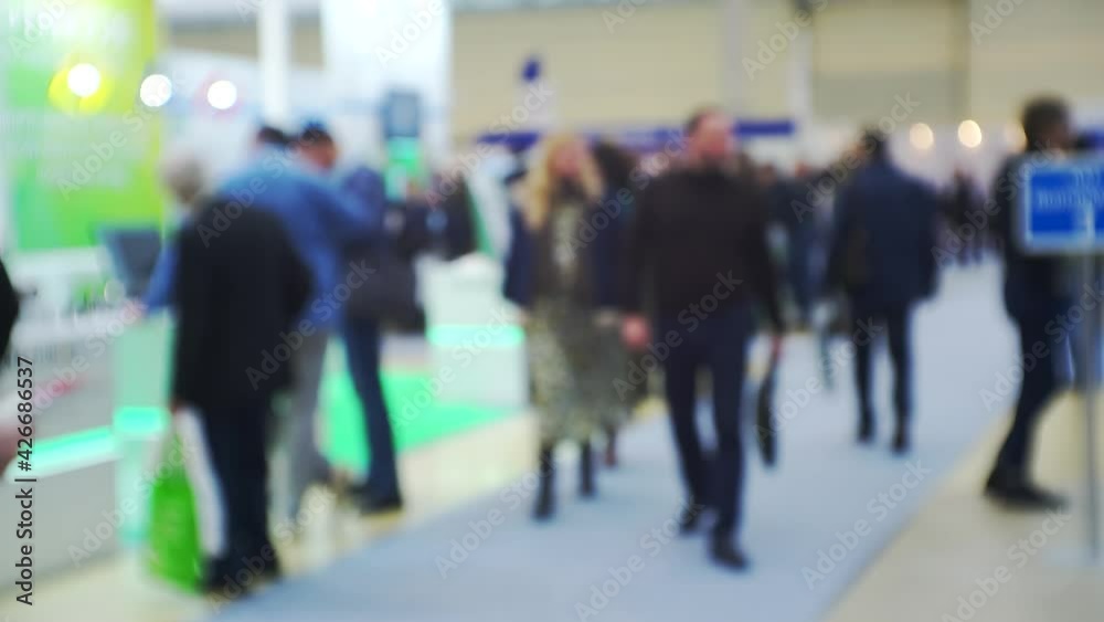 Modern city life. Abstract blurred background on business theme. Blurry defocused video. Unrecognizable people in a large modern building. Modern city life. Abstract blurred background on business theme. Blurry defocused video. Unrecognizable people in a large modern building.