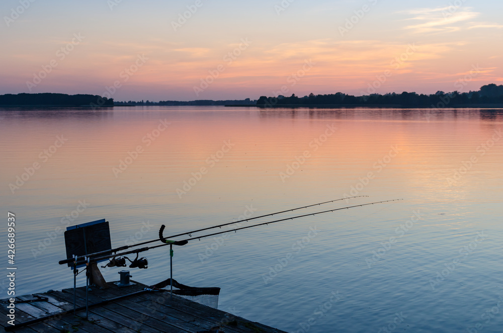 A pier for fishermen at the lake A pier for fishermen at the lake