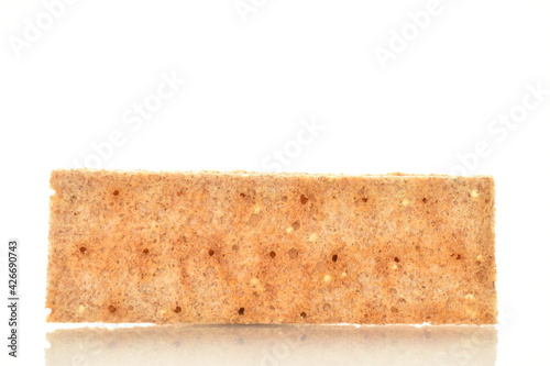 Light brown multi-grain rye crispbread, close-up, isolated on white.