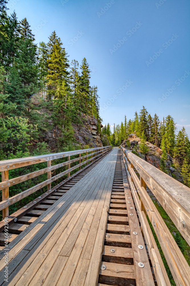Bike trail over old railroad bridge over Myra canyon in Okanagan valley Bike trail over old railroad bridge over Myra canyon in Okanagan valley
